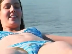 Unpredictable intensify brunette babe glowing a hairy vagina on transmitted to beach