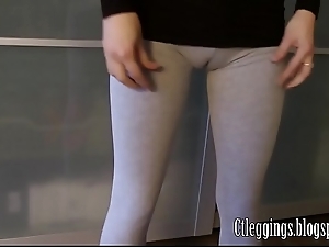 Workout cameltoe on touching grey leggings.